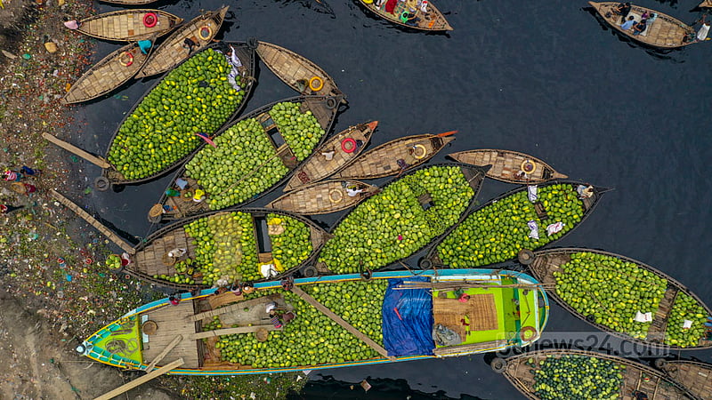 Farmers transport watermelons to the dock at Old Dhaka’s Wais Ghat on small boats after unloading them from launches. Photo: Mostafigur Rahman