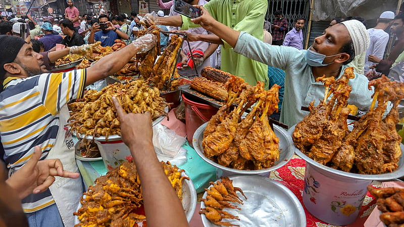 The shops on the street outside Shahi Mosque in Old Dhaka’s Chawkbazar are filled with traditional Iftar items on the first day of Ramadan on Friday, Mar 24, 2023. Photo: Asif Mahmud Ove