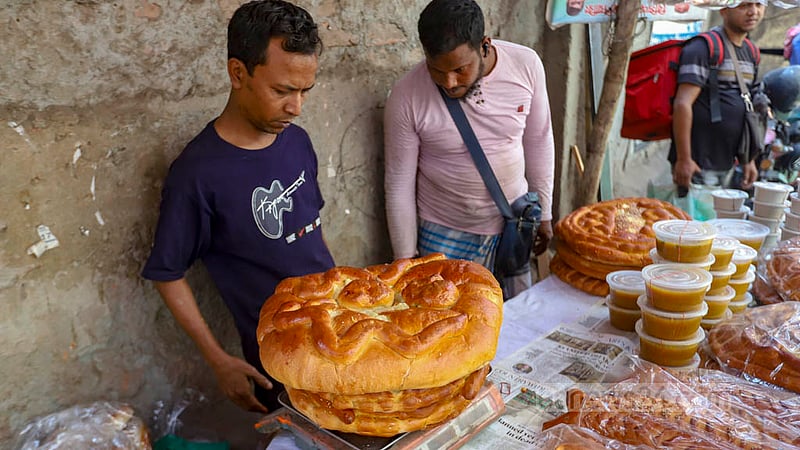 Loaves of bread priced at Tk 300 a kg are on sale at a shop on Nazimuddin Road in Old Dhaka on Shab-e-Barat on Tuesday, Mar 7, 2023. Photo: Mahmud Zaman Ovi