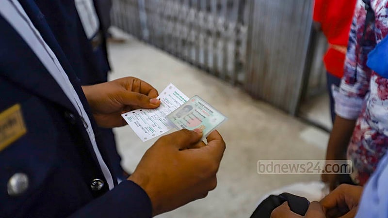 Passenger's name on the ticket is verified against their national ID card at Kamalapur Railway Station in Dhaka on the first day of a new train ticket sale system on Wednesday, Mar 1, 2023. Photo: Mahmud Zaman Ovi