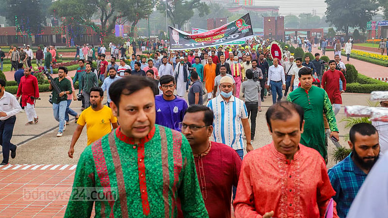 People from all walks of life arrive at the National Martyrs’ Memorial on Sunday, Mar 26, 2023 to pay tributes to the brave souls who lost their lives fighting for Bangladesh’s independence. Photo: Asif Mahmud Ove