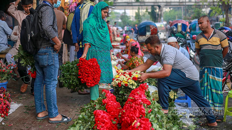 Customers browse flowers at a shop in the wholesale flower market in Dhaka’s Shahbagh. Photo: Tawhiduzzaman Tapu