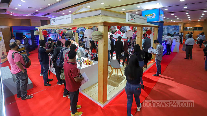 People visit a shop showcasing foreign goods at the Bangladesh Travel and Tourism Fair at Bangabandhu International Conference Centre in Dhaka on Thursday, Mar 2, 2023. Photo: Asif Mahmud Ove