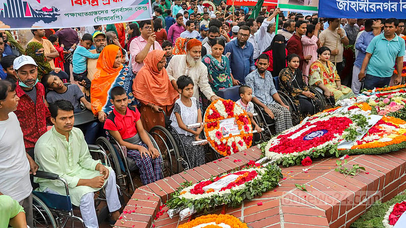 People with disabilities arrive at the National Martyrs’ Memorial in Savar on Sunday, Mar 26, 2023 to pay their respects to the martyrs of the Liberation War. Photo: Asif Mahmud Ove