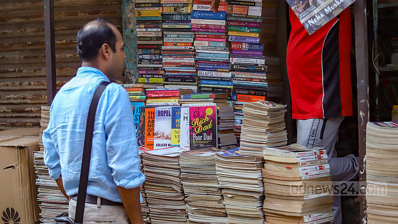 People of all ages visit the old books section in the Nilkhet book market. A lot of them frequent the market in search of their favourite books.  Photo: Mahmud Zaman Ovi