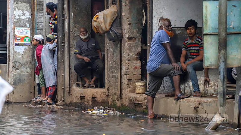 Traders in the Sikkatuli intersection on the Majed Sarkar Road in Old Dhaka’s Bangshal suffer as the road remains flooded with filthy water throughout the year. Photo: Asif Mahmud Ove