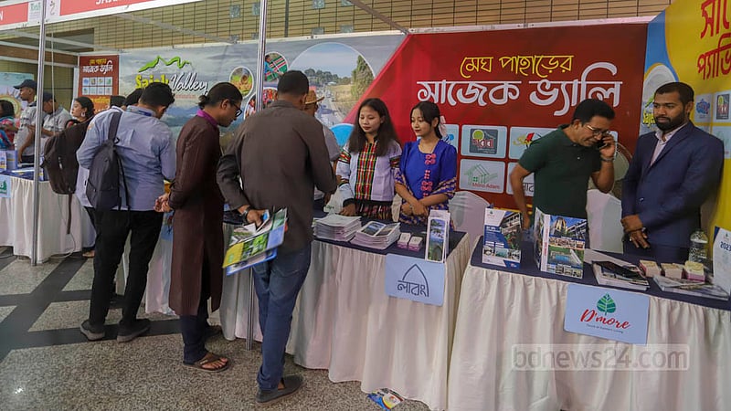 People visit a stall on the first day of the three-day-long Bangladesh Travel and Tourism Fair at the Bangabandhu International Conference Centre in Dhaka on Thursday, Mar 2, 2023. Photo: Asif Mahmud Ove