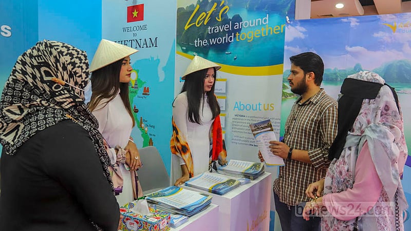 People visit a shop showcasing foreign goods at the Bangladesh Travel and Tourism Fair at Bangabandhu International Conference Centre in Dhaka on Thursday, Mar 2, 2023. Photo: Asif Mahmud Ove