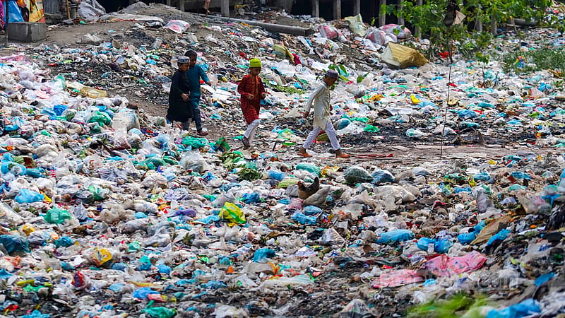 The layers of waste on the Shubhaddya canal in Dhaka's Keraniganj are so thick that children can walk on the surface. Photo: Mahmud Zaman Ovi