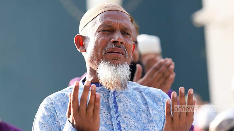 Muslims embrace each other after Eid prayer congregation at the Baitul Mukarram National Mosque on Saturday, Apr 22, 2023. Photo: Mahmud Zaman Ovi