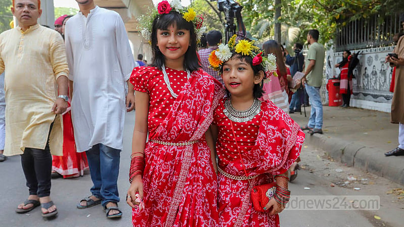 Children and adults enjoy the Bangla New Year celebrations at Dhaka University on Friday, Apr 14, 2023. Photo: Asif Mahmud Ove