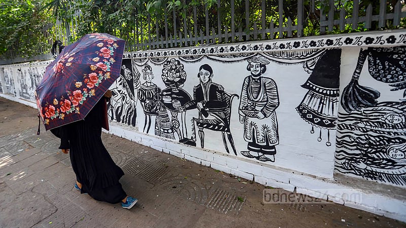 Dhaka University’s Faculty of Fine Arts decorates the entrance wall in preparation for Bangla New Year celebrations like every year.Photo: Mahmud Zaman Ovi