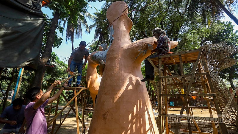 Students of Dhaka University’s Faculty of Fine Arts put things in place for the Mangal Shobhajatra on Thursday, Apr 13, 2023, the eve of Pahela Baishakh, as they prepare for the procession to celebrate Bangla New Year.