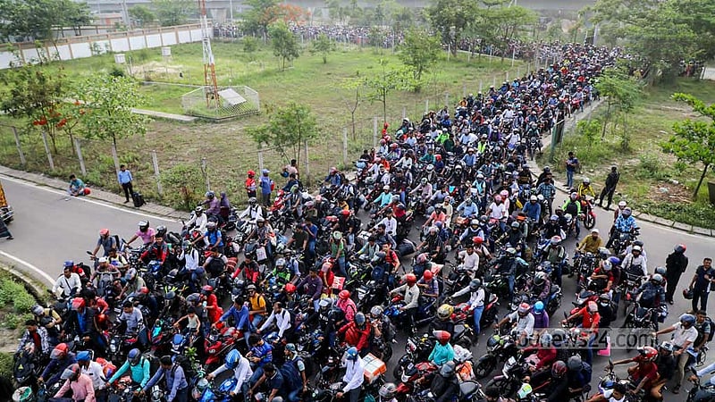 Apr 20: Motorcyclists que up to cross the Padma Bridge after a ban on motorbikes on the bridge is lifted. 