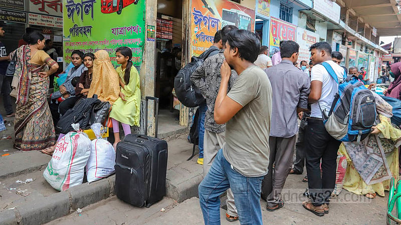 Passengers wait for buses at Gabtoli Inter-district Bus Terminal on Tuesday, Apr 18, 2023. Photo: Asif Mahmud Ove