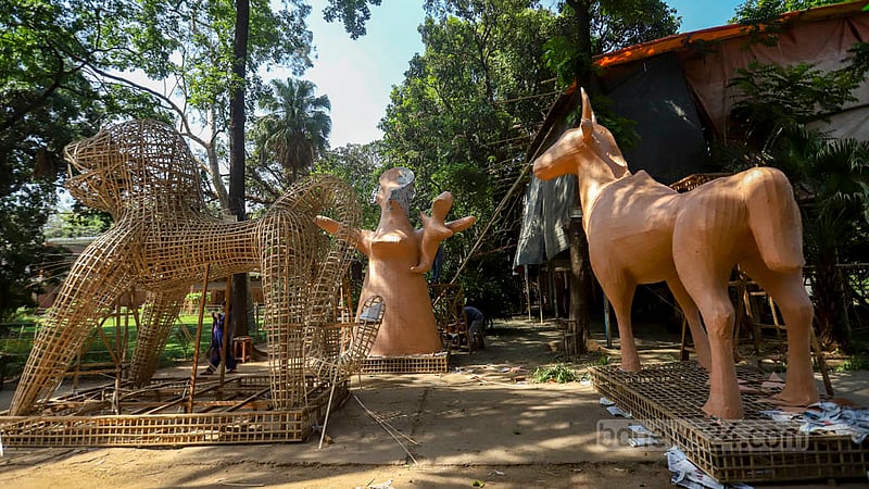 Students of Dhaka University’s Faculty of Fine Arts put things in place for the Mangal Shobhajatra on Thursday, Apr 13, 2023, the eve of Pahela Baishakh, as they prepare for the procession to celebrate Bangla New Year.