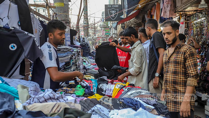 People with a low income buy dresses in Dhaka before Eid-ul-Fitr.