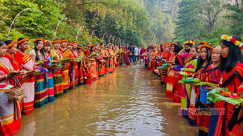 The women of Khagrachhari's Khagrapur area gather near a hillside waterfall wearing the traditional dress Rina-Risai as part of their Vaisu celebrations. Photo: Samir Mallik