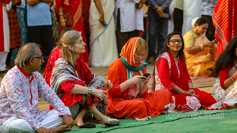 Foreign guests also join Chhayanaut’s event at Ramna Batamul in Dhaka wearing colourful Boishakhi attires on Friday, Apr 14, 2023. Photo: Mahmud Zaman Ovi