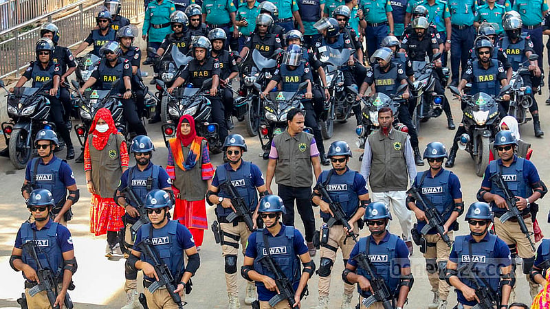 Law enforcers ensure tight security around the Mangal Shobhajatra procession through a key Dhaka road during the celebrations of the first day of the Bangla New Year on Friday, Apr 14, 2023. Photo: Mahmud Zaman Ovi