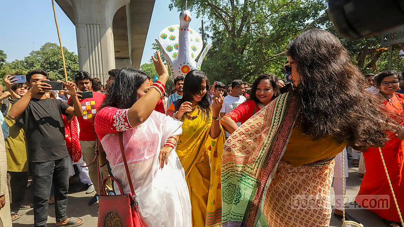 Dhaka University students participate in the Mangal Shobhajatra procession and dance to drum beats on Friday, Apr 14, 2023. Photo: Asif Mahmud Ove