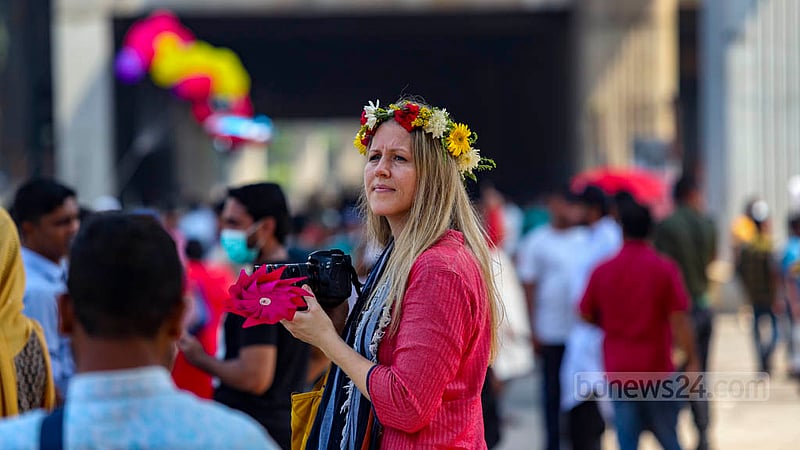 Foreigners participate in the Bangla New Year celebration at Dhaka University along with locals from all walks of life on Friday, Apr 14, 2023. Photo: Mahmud Zaman Ovi
