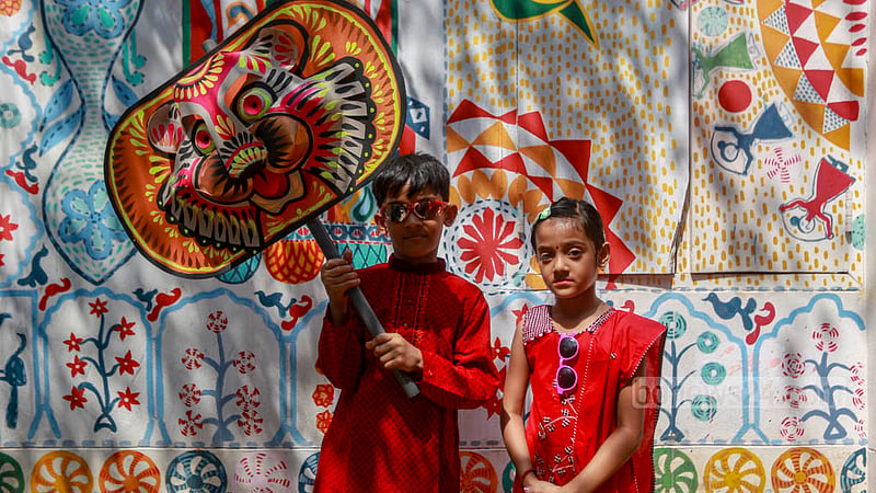 Children adorned in Baishakhi clothes participate in Dhaka University’s Bangla New Year celebrations on Friday, Apr 14, 2023. Photo: Tawhiduzzaman Tapu