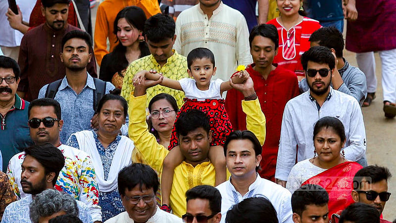 Children participate in the Mangal Shobhajatra procession along with adults to welcome the Bangla New Year on Friday, Apr 14, 2023. Photo: Asif Mahmud Ove
