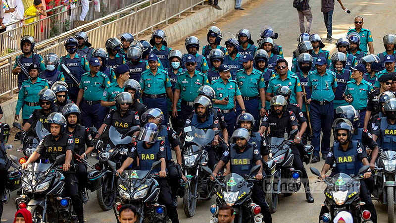 Law enforcers ensure tight security around the Mangal Shobhajatra procession through a key Dhaka road during the celebrations of the first day of the Bangla New Year on Friday, Apr 14, 2023. Photo: Mahmud Zaman Ovi