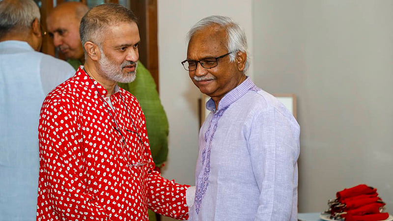 Dr Mohammad Mushtuq Husain, adviser of the National Institute of Epidemiology, Disease Control and Research (IEDCR) meets Toufique Imrose Khalidi, editor-in-chief of bdnews24.com at the Bengali New Year celebration event.