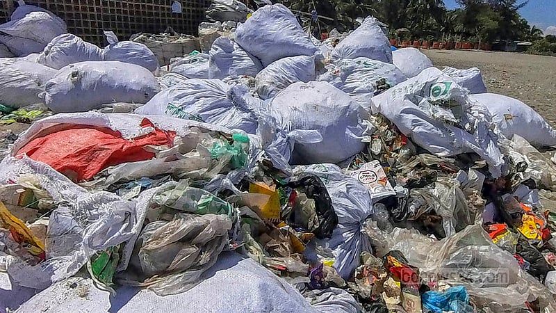 Sacks of plastic garbage collected from the nearby area, the ocean and other parts of the island have been left next to the pier at St Martin’s Island. photo: Sharif Sarwar