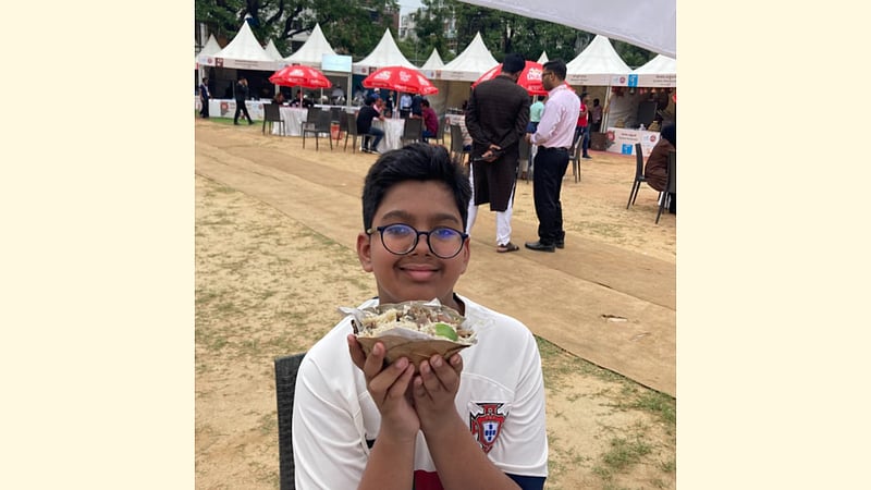 Trying Haji Biryani in a bowl of dried jackfruit leaves.