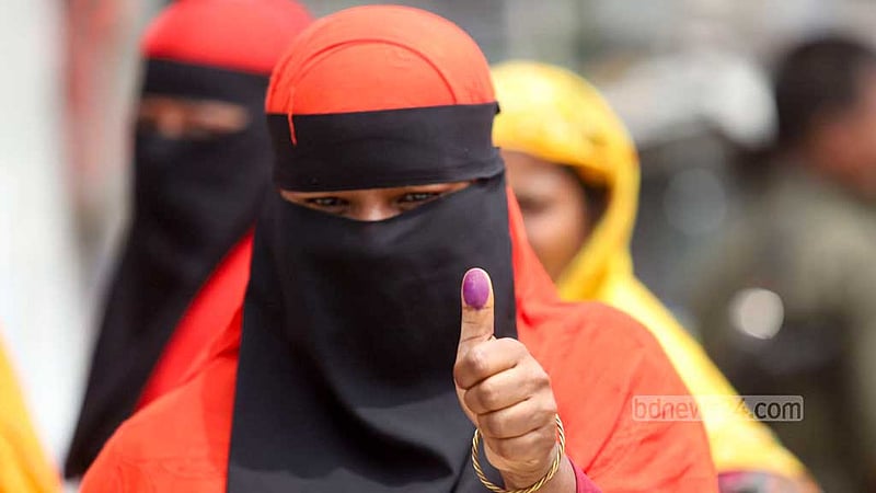 A woman shows ink on the thumb after casting her vote at a centre during the Gazipur City Corporation election on Thursday, May 25, 2023. Photo: Mahmud Zaman Ovi