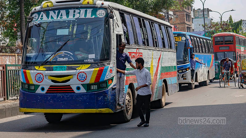 Buses stop right in the middle of the road near Rampura TV Centre to let passengers on and off although the designated safe spot is just a few metres away. Photo: Mahmud Zaman Ovi