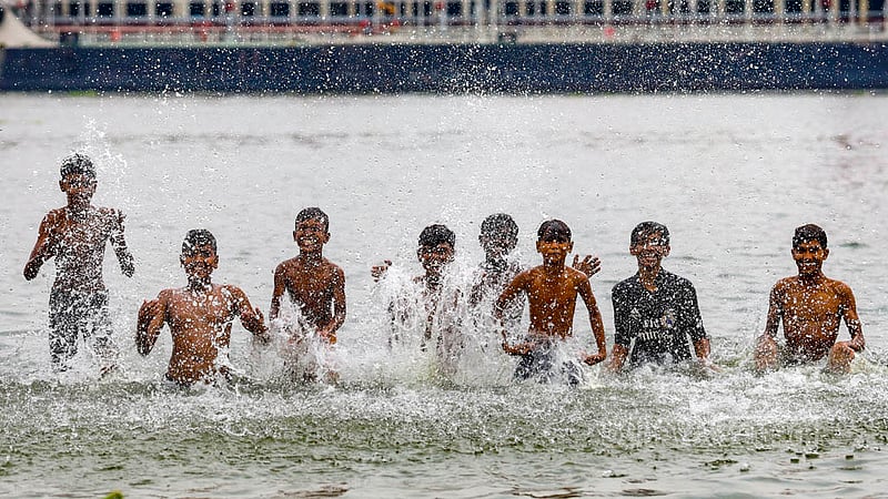 A group of children play in the waters of the Buriganga River in Dhaka. Photo: Mahmud Zaman Ovi