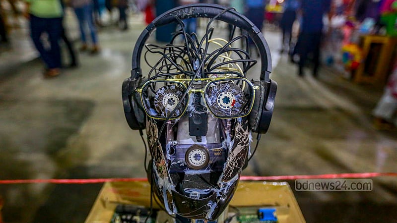 Members of the Titumir Art Club construct a robot with unused plastic for display in an exhibition at the Shaheed Barkat Auditorium. Photo taken on Monday, May 29, 2023. Photo: Tawhiduzzaman Tapu