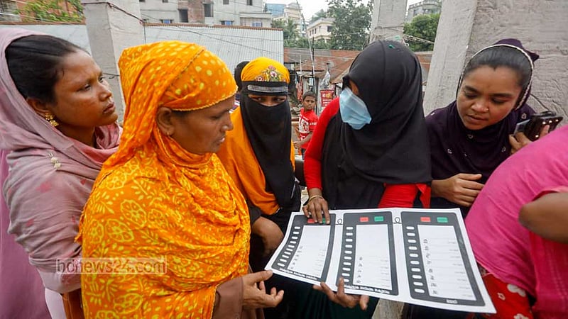 Election officials showcase the process of using EVMs to voters at the Madrasatul Islam Tongi and Shamsunnahar Mohila Madrasa centre in Gazipur.