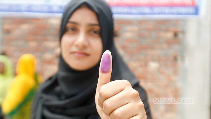 A girl shows ink on the thumb after casting her vote at a centre during the Gazipur City Corporation election on Thursday, May 25, 2023. Photo: Mahmud Zaman Ovi