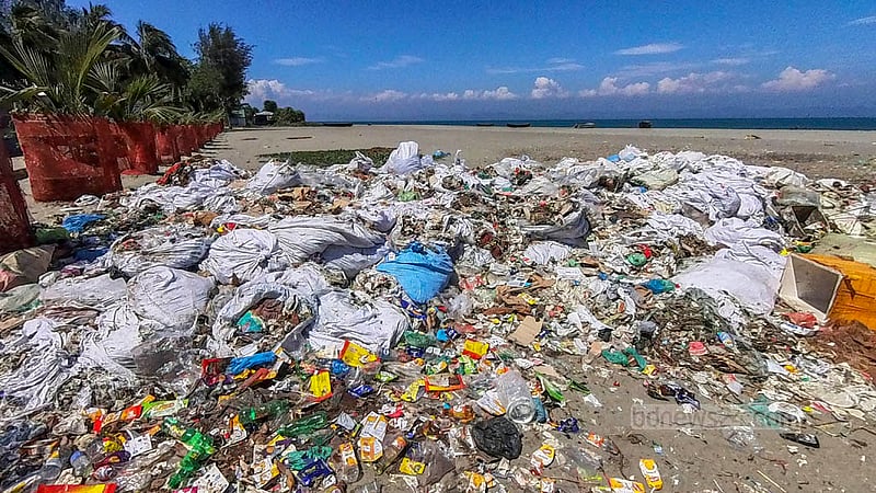 Several of the sacks of plastic waste left next to the pier at St Martin’s Island have been there for an extended period of time and have been torn. There is concern that if there is a significant natural disaster in the area, like the coming Cyclone Mocha, the waste may be washed out to sea once more. photo: Sharif Sarwar
