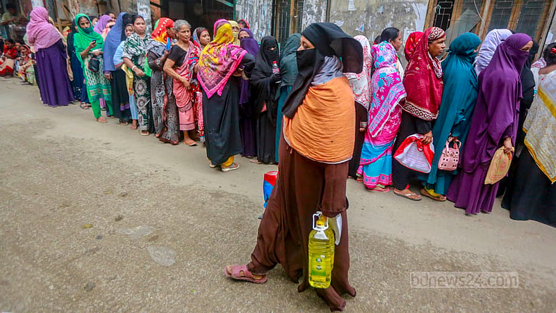 A woman returns home after buying TCB goods in Dhaka’s Lalbagh, on Sunday, Jun 11, 2023. Photo: Tawhiduzzaman Tapu