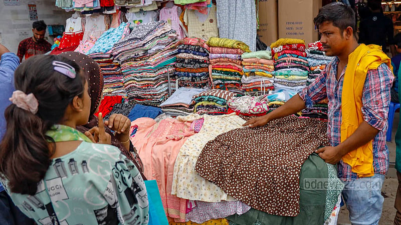 People spend time mostly on cattle purchase and rearing before Eid-ul-Azha. Some of them visit Dhaka’s New Market for shopping on Tuesday, Jun 27, 2023. Photo: Mahmud Zaman Ovi
