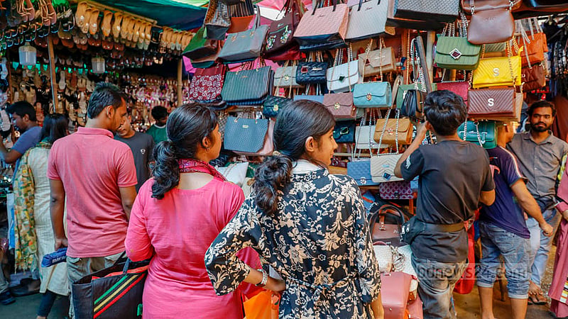 Handbags are among the essential Eid fashion accessories for many. Customers visit Dhaka’s New Market on Tuesday, Jun 27, 2023, to buy bags before Eid-ul-Azha. Photo: Mahmud Zaman Ovi