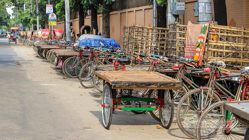 Illegally parked rickshaw-vans occupy parts of the street in Dhaka’s Tejgaon industrial area. Photo: Asif Mahmud Ove