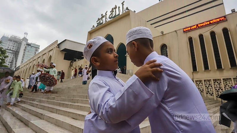 Muslims embrace at the end of Eid prayers as a sign of affection and brotherhood. Photo: Asif Mahmud Ove
