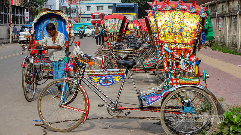 Rickshaw-vans are parked illegally on the street of Tejgaon in Dhaka, hampering traffic and pedestrian movements. Photo: Asif Mahmud Ove