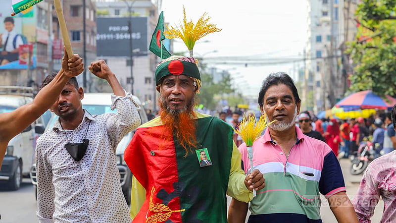 An activist joined the BNP march while adorned with national and party flags and symbols during the second day of the party's demonstrations to press for the 'one-point' movement to oust the Awami League government. Photo: Asif Mahmud Ove