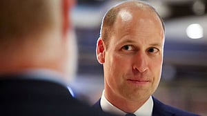 Prince William serves up food to surprised diners