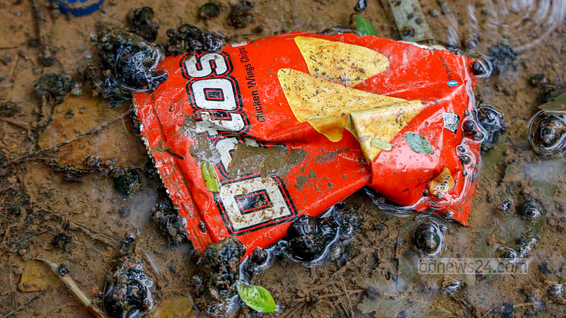 An empty packet of chips floats on the water, though the lake has dustbins placed at different locations. Photo: Mahmud Zaman Ovi
