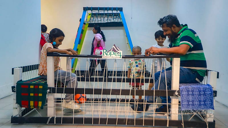 Children play at a corner for them at a photography exhibition of Bhromon Konya - The Travelettes of Bangladesh, a group of women who love to travel, at the Shilpakala Academy in Dhaka on Saturday, Aug 5, 2023. Photo: Tawhiduzzaman Tapu