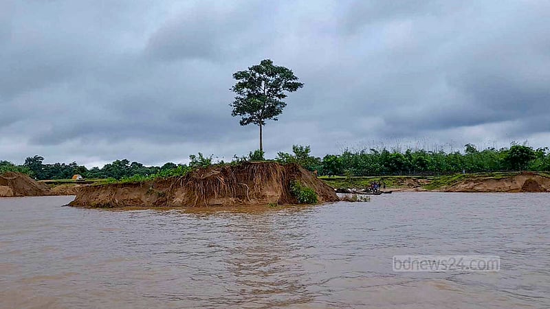 Water flowing downstream from India’s Meghalaya meets the Jadukata River in Tahirpur. But the banks of the river are losing their natural beauty due to excessive sand and stone extraction.
